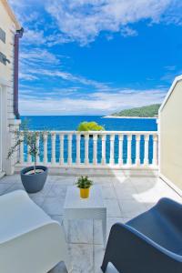 a balcony with a view of the ocean at Luxury Bellavista Amazing sea Holidays with Private Beach & Parking in Hvar
