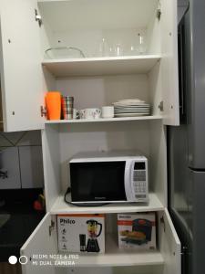A kitchen or kitchenette at Porto das Dunas