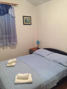 Postel nebo postele na pokoji v ubytování Apartments Anka