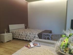 Un pat sau paturi într-o cameră la Casa Melograno
