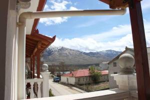 a view of the mountains from a balcony of a house at Guest House Stena in Ersekë