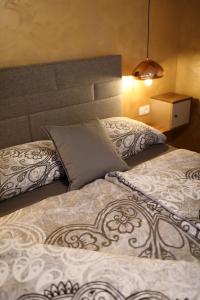 Postel nebo postele na pokoji v ubytování Vila Lapidem