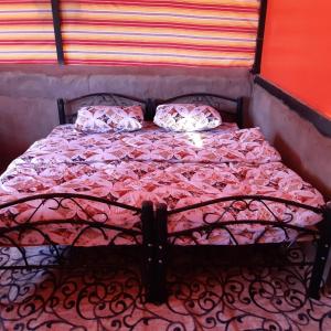 Кровать или кровати в номере mountain village camp- wadi rum