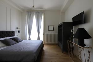 Postel nebo postele na pokoji v ubytování B&B Dimora del Duomo