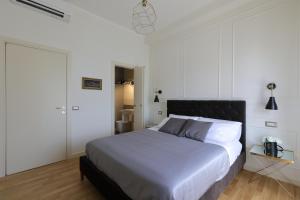 Postel nebo postele na pokoji v ubytování B&B Dimora del Duomo