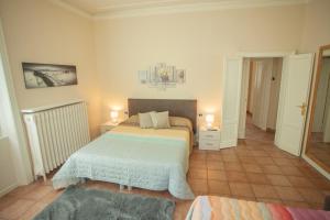 A bed or beds in a room at Villa Moiacchina Luxury Home