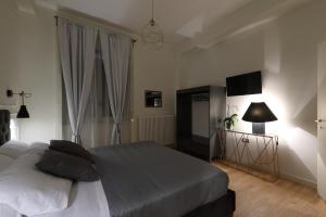 Postel nebo postele na pokoji v ubytování B&B Dimora del Duomo