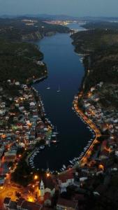 an aerial view of a harbor with boats in the water at Apartments Martinović in Zaton