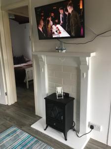 TV a/nebo společenská místnost v ubytování Chalet 26