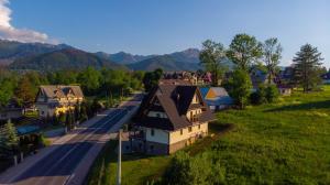 an aerial view of a village with a road and houses at Willa Rychlina in Zakopane