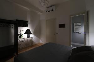 Postel nebo postele na pokoji v ubytování B&B Dimora del Duomo
