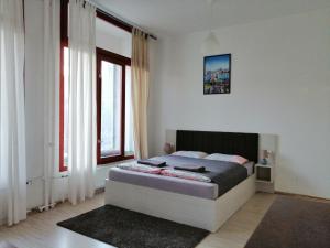 Posteľ alebo postele v izbe v ubytovaní Zoom-Budapest Apartments