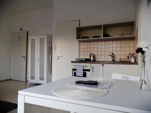 a kitchen with a white counter top in a room at Zoom-Budapest Apartments in Budapest