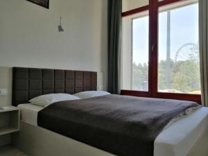 Posteľ alebo postele v izbe v ubytovaní Zoom-Budapest Apartments