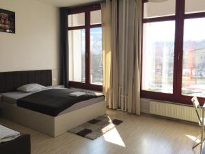 Posteľ alebo postele v izbe v ubytovaní Zoom-Budapest Apartments