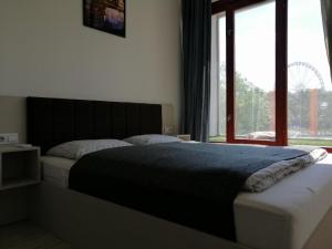 Posteľ alebo postele v izbe v ubytovaní Zoom-Budapest Apartments