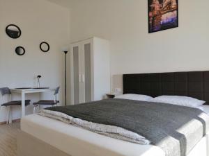 Posteľ alebo postele v izbe v ubytovaní Zoom-Budapest Apartments