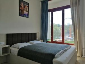 Posteľ alebo postele v izbe v ubytovaní Zoom-Budapest Apartments