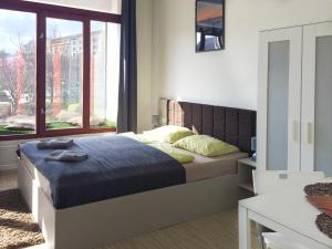 Posteľ alebo postele v izbe v ubytovaní Zoom-Budapest Apartments