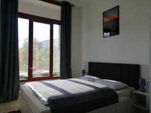 Posteľ alebo postele v izbe v ubytovaní Zoom-Budapest Apartments