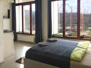 Posteľ alebo postele v izbe v ubytovaní Zoom-Budapest Apartments