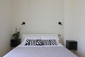 Postel nebo postele na pokoji v ubytování B&B Dimora del Duomo