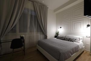 Postel nebo postele na pokoji v ubytování B&B Dimora del Duomo