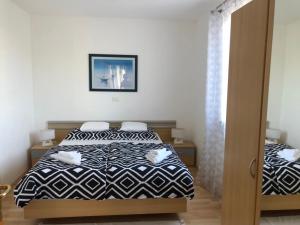 Ein Bett oder Betten in einem Zimmer der Unterkunft VILLA DIVNA