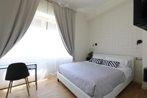 Postel nebo postele na pokoji v ubytování B&B Dimora del Duomo