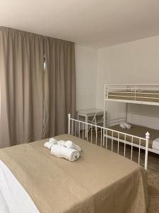 Postel nebo postele na pokoji v ubytování Le tre colonne
