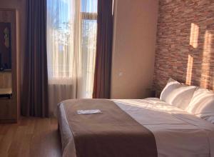 Postel nebo postele na pokoji v ubytování Continental Hotel