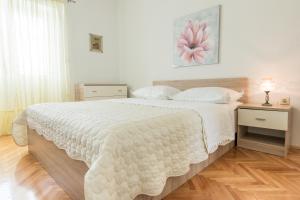 Postel nebo postele na pokoji v ubytování Apartments Fanito