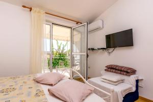 Posteľ alebo postele v izbe v ubytovaní Apartments Berislav