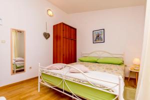 Posteľ alebo postele v izbe v ubytovaní Apartments Berislav