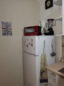 Una cocina o zona de cocina en Condominio Reino de Italia, Serena