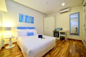 Ліжко або ліжка в номері Palmier Hotel - Art House Da Nang