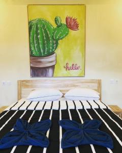 Rúm í herbergi á Lazy Inn Kuta Lombok