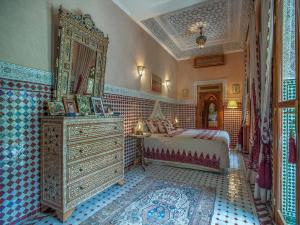 Postel nebo postele na pokoji v ubytování Riad & Spa Laurence Olivier