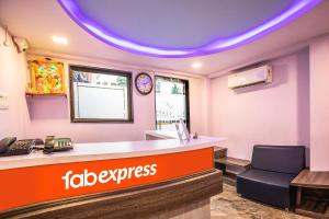 a fast food restaurant with a waiting room with a desk at FabExpress Silver Lake in Mumbai