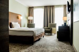 Postel nebo postele na pokoji v ubytování Hotel Jakob Regensburg DownTown, Best Western Signature Collection