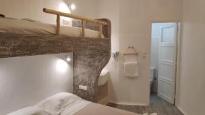 Posteľ alebo postele v izbe v ubytovaní Grey Rooms Naxos