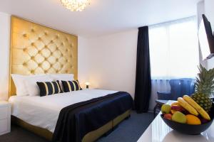 Postel nebo postele na pokoji v ubytování B Gold Luxury rooms B&B