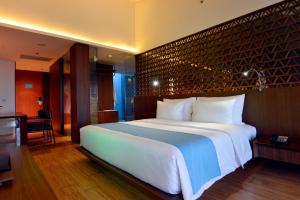 Postel nebo postele na pokoji v ubytování IZE Seminyak by LifestyleRetreats
