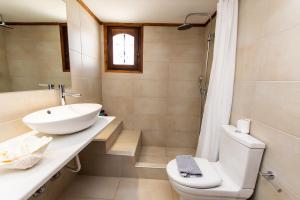 a bathroom with a toilet and a sink at Anchor Αpartments in Mýkonos City