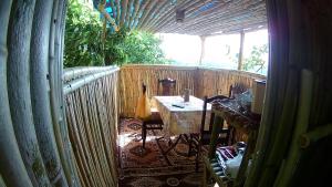 an outside room with a table and a fence at Eagle Nest in Martvili