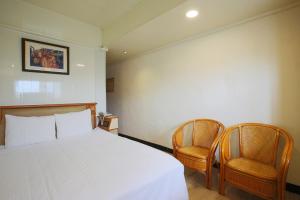 Postel nebo postele na pokoji v ubytování Lion Hotel