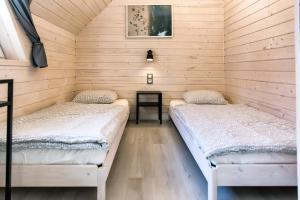 A bed or beds in a room at Villa Baltica