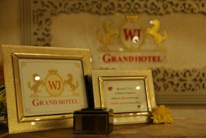 two framed certificates sitting on top of a table at Hotel WJ Grand in Jalandhar