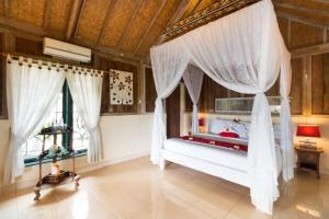 Ein Bett oder Betten in einem Zimmer der Unterkunft Umasari Rice Terrace Villa by AGATA
