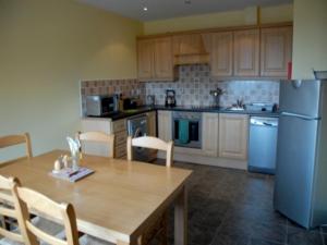 A kitchen or kitchenette at Tralee Bay Holiday Village